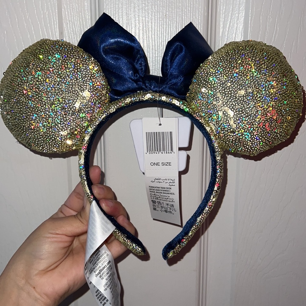 NWT 50th Anniversary Minnie Ears Gold sequenced ears with navy blue bow. - Picture 2 of 3